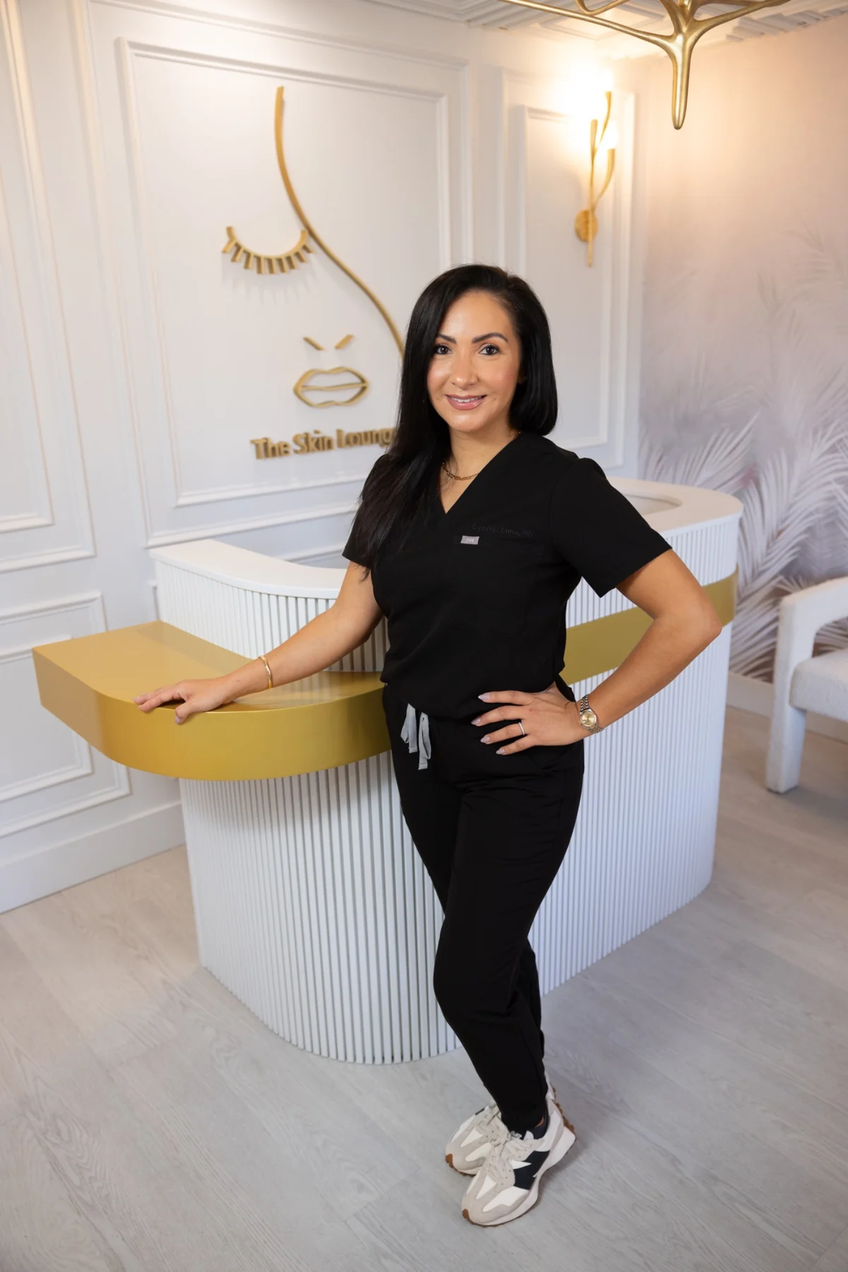 Aesthetics provider photographed at the reception of a modern clinic
