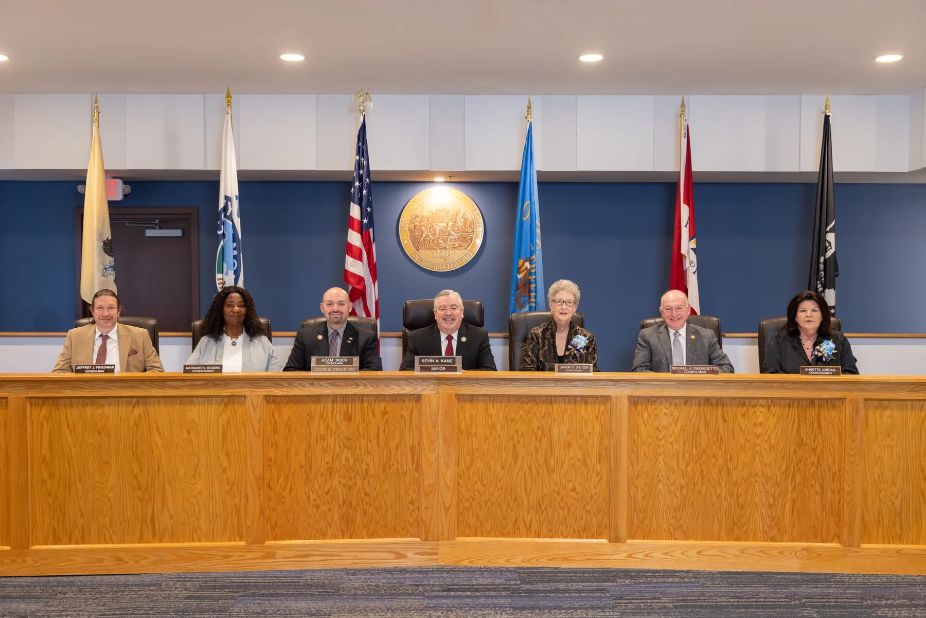 Civic leadership group seated for an official group photograph
